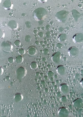 Drops from rain on glass as background