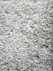 Gray plaster coat on the wall as a background
