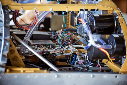 The interior of the instrument panel of a light single-engine aircraft without coating. - Powered by Adobe