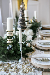 Table served for Christmas dinner in living room, close up view