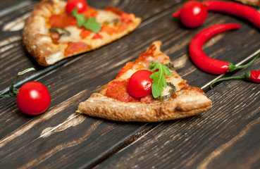 pizza on wood table with ingredients