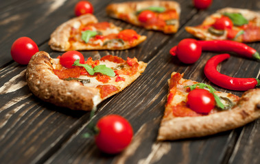 pizza on wood table with ingredients
