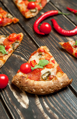 pizza on wood table with ingredients