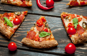 pizza on wood table with ingredients