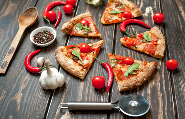 pizza on wood table with ingredients