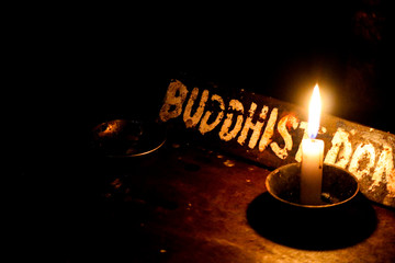 Buddhism with a candle light