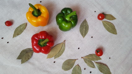 Sweet pepper of different colors, tomatoes and Bay leaf. Red, yellow, green.