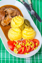 Roast turkey in gravy.