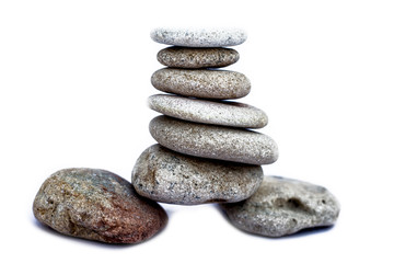 A bunch of pebbles or small stones on each other isolated on white.