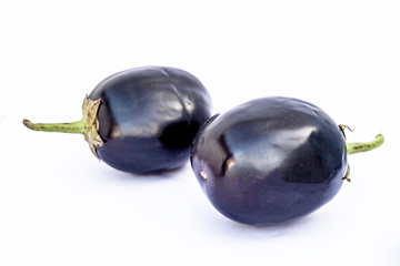 Close up of fresh organic egg plant or bringal or Aubergines or brinjal or baingan or eggplant isolated on white.