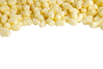 Scattered sweet corn sticks isolated on white.