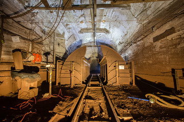 Underground gold iron ore mine shaft tunnel gallery passage with wagon tipper