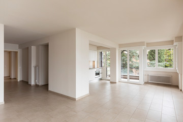 Open space with large windows and modern kitchen