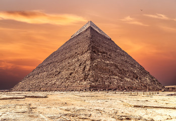 Fototapeta na wymiar The Pyramid of Khafre or of Chephren at sunset, is the second-tallest and second-largest of the Ancient Egyptian Pyramids of Giza and the tomb of the Fourth-Dynasty pharaoh Khafre (Chefren)