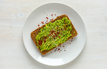 Smashed avocado toast with chilli and copy space