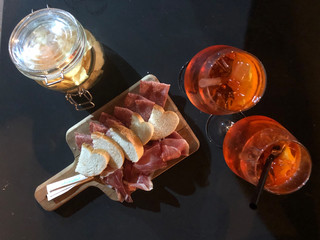 Spritz cocktails with some meat and chips