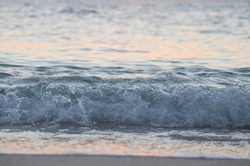 waves on beach at sunset