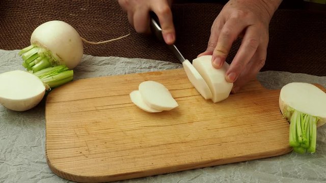 Japanese white fresh vegetable turnip root. Sliced daikon radish
