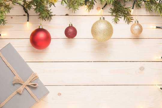 Christmas composition. Christmas gift. christmas ball. pine cones. fir branches on white wooden background. copy space