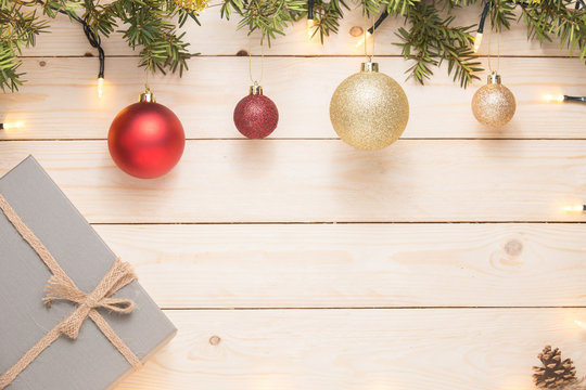 Christmas composition. Christmas gift. christmas ball. pine cones. fir branches on white wooden background. copy space