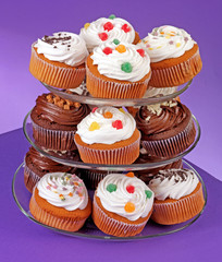 CAKE STAND WITH ICED CUPCAKES OR MUFFINS