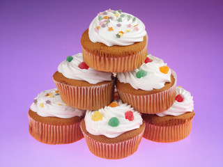 STACK OF FROSTED CUPCAKES OR MUFFINS