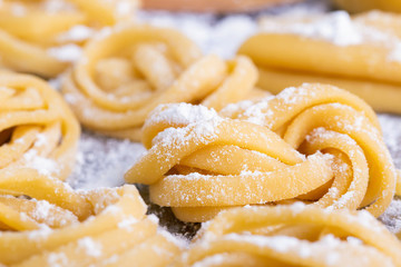 pasta with pasta ingredients on the dark wooden table top view