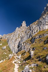 Panoramic view of the towers and spiers of the southern Grigna from the direct route, on a sunny autumn day.