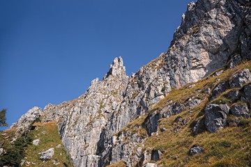 Panoramic view of the towers and spiers of the southern Grigna from the direct route, on a sunny autumn day.