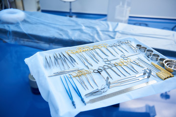 Top view of table with sterile instruments in operating room