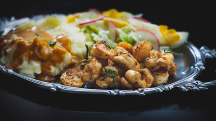 roasted shrimps with mashed potatoes gravy and salad