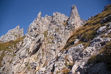 Panoramic view of the towers and spiers of the southern Grigna from the direct route, on a sunny autumn day.