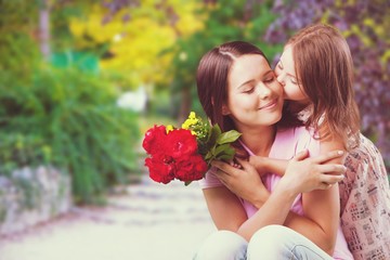 Young woman with little girl and beautiful