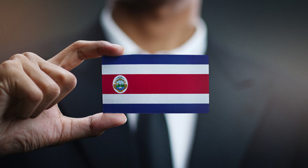 Businessman Holding Card of Costa Rica Flag