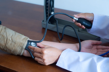 close up hand of doctor and patient using checking measuring arterial blood pressure    .   healthcare or Health check, hospital and medicine concept