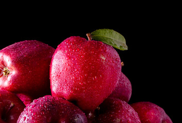 Red apples with leaves on the table