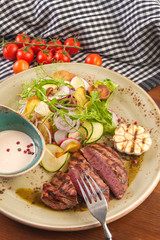 beef chop with salad of vegetables and mushrooms