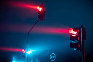 Red traffic light in fog