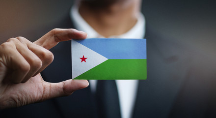 Businessman Holding Card of Djibouti Flag