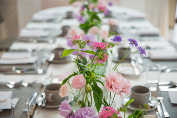 Party table decorated with beautiful flowers