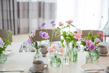 Fototapeta na wymiar Party table decorated with beautiful flowers