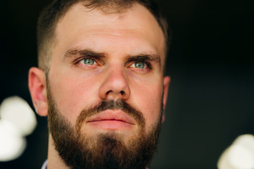 Obraz premium the face of the groom with a well-groomed and stylish beard who