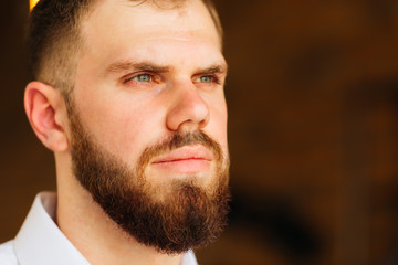 Obraz premium the serious face of the groom who look into the distance. The gr