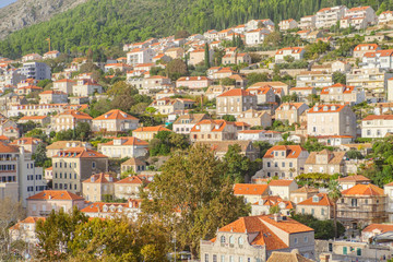 Fototapeta na wymiar Scenic view of urban part on hills in ancient touristic town Dubrovnik in Croatia. Beautiful aerial view of old european resort on Adriatic sea.