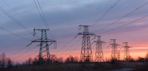 Power lines on the sky background © Yurii Shelest