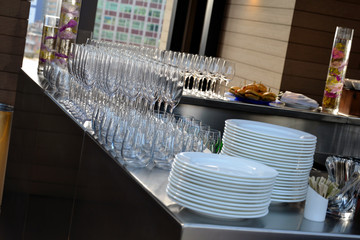 Empty glasses and dishes on the buffet counter