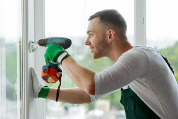 Man is installing window handle