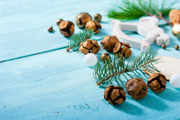 traditional Christmas ornaments on old blue wooden table background