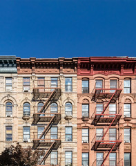 Empty blue sky above old buildings in the East Village neighborhood of New York City