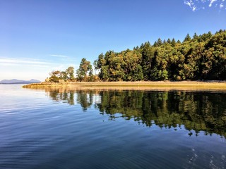 The beautiful pristine Tent Island in the Gulf Islands of British Columbia, Canada.  The island...